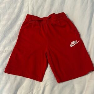 Nike, boys size 7 red sportswear club fleece shorts.